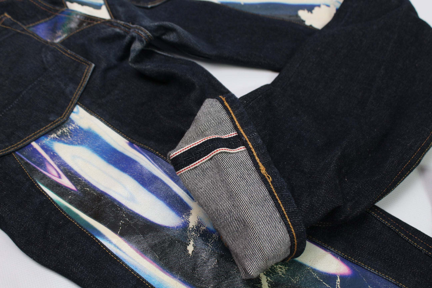 EVISU Blue Daicock Denim Selvedge jeans, size 32, baggy fit, dark blue color, 100% cotton, made in Japan, showing selvedge detailing.