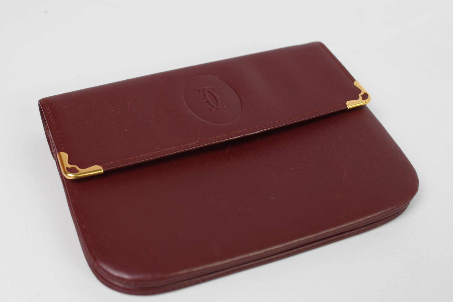 CARTIER Leather Longwallet Bordeaux, red leather, 15x10 cm, excellent condition.