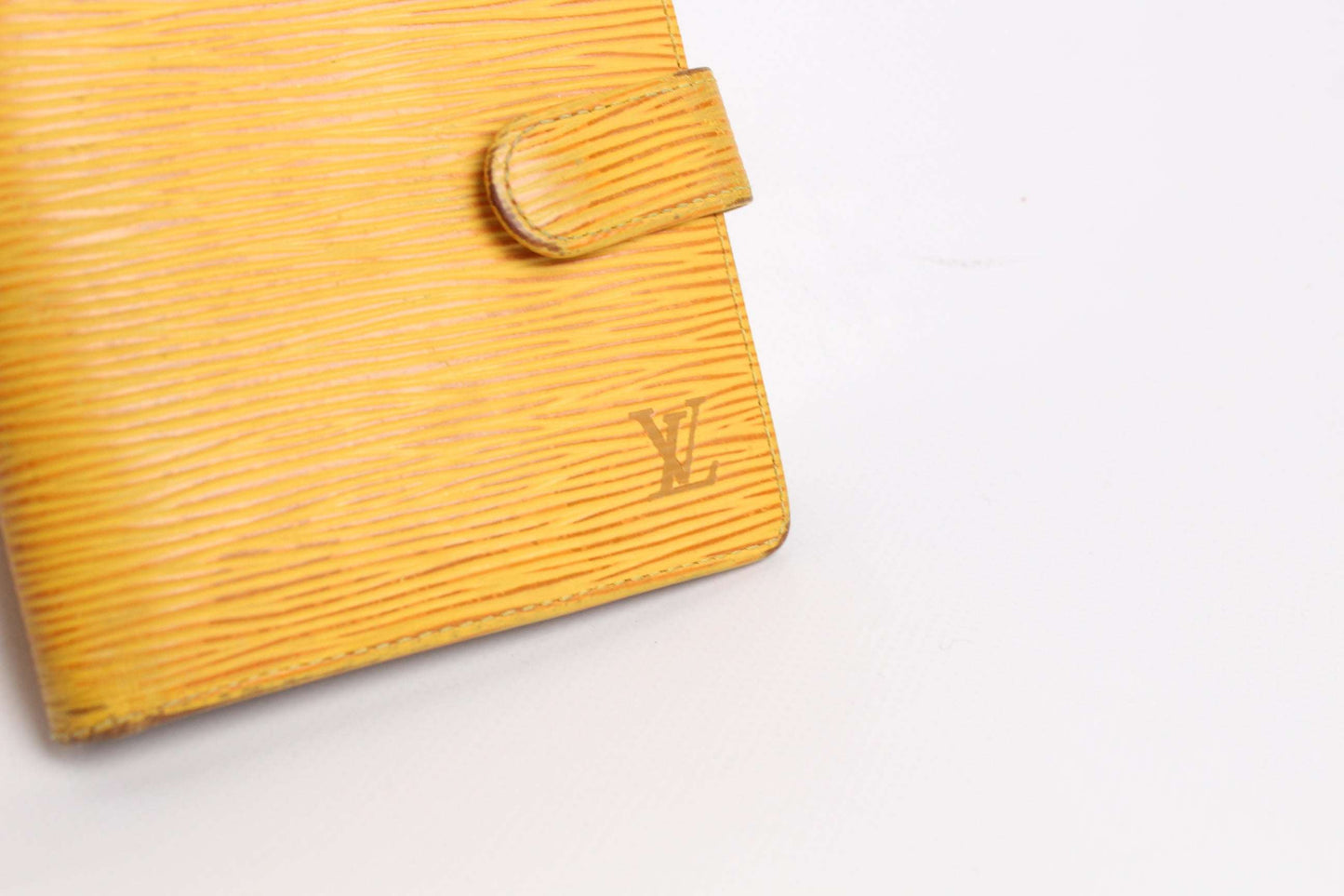 LOUIS VUITTON Epi Portemonnaie Yellow leather wallet with monogram detail.