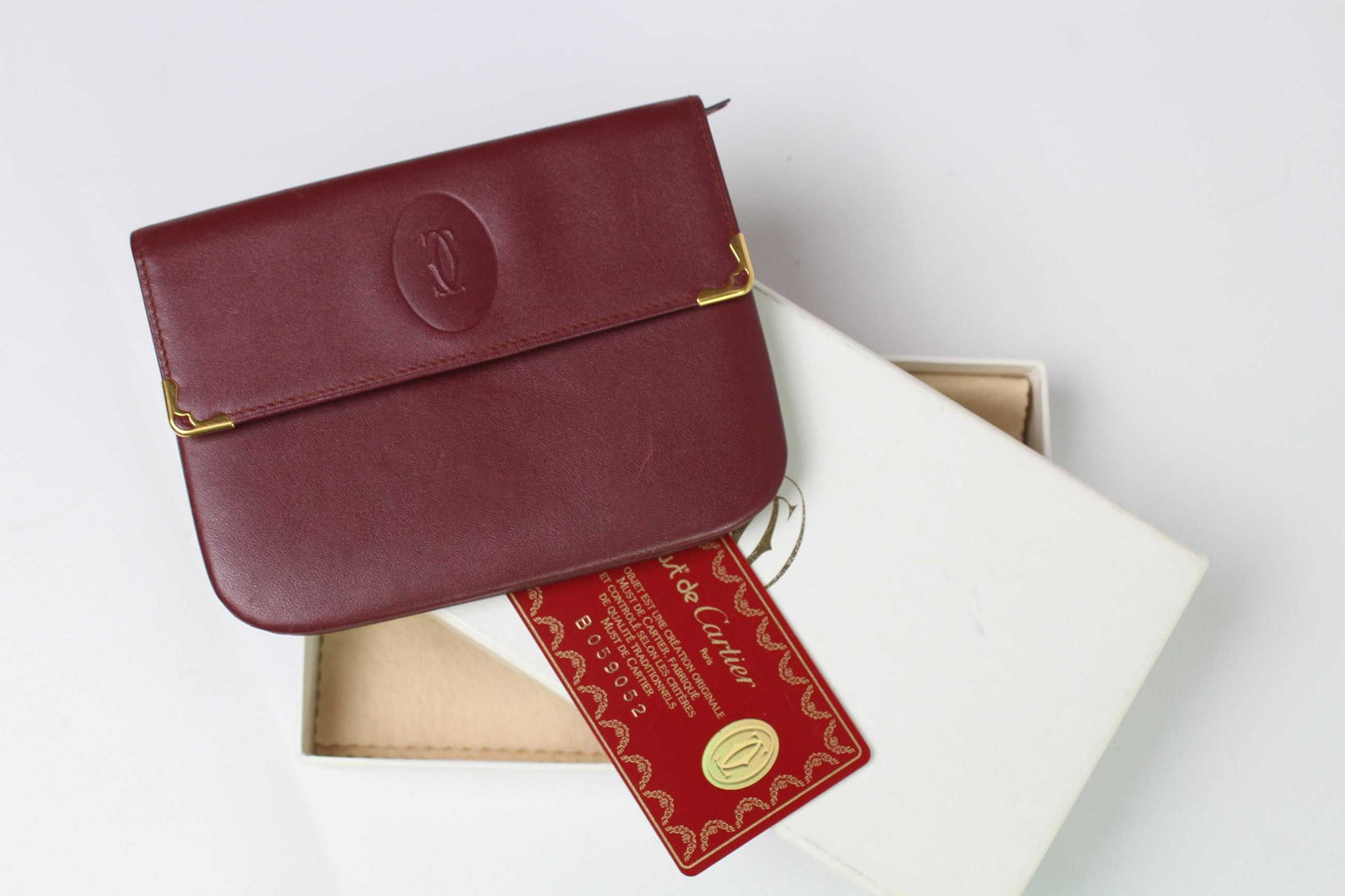 CARTIER Leather Longwallet Bordeaux, red leather, size 15x10 cm, with box and authenticity card.