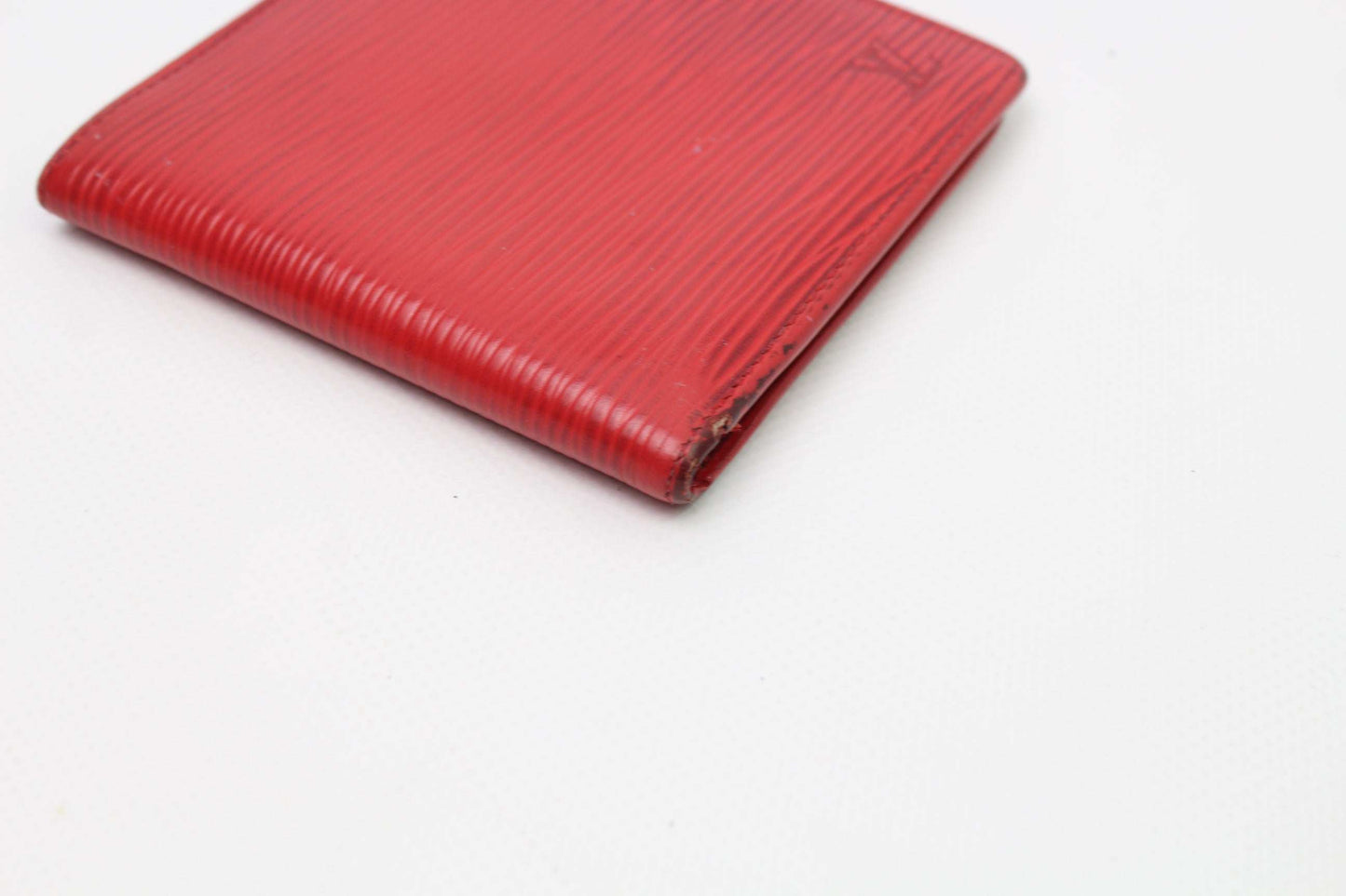 LOUIS VUITTON Epi Portemonnaie in red leather, size 10x10cm.
