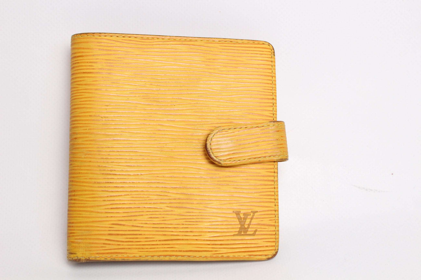 Yellow Louis Vuitton Epi leather portemonnaie with logo.
