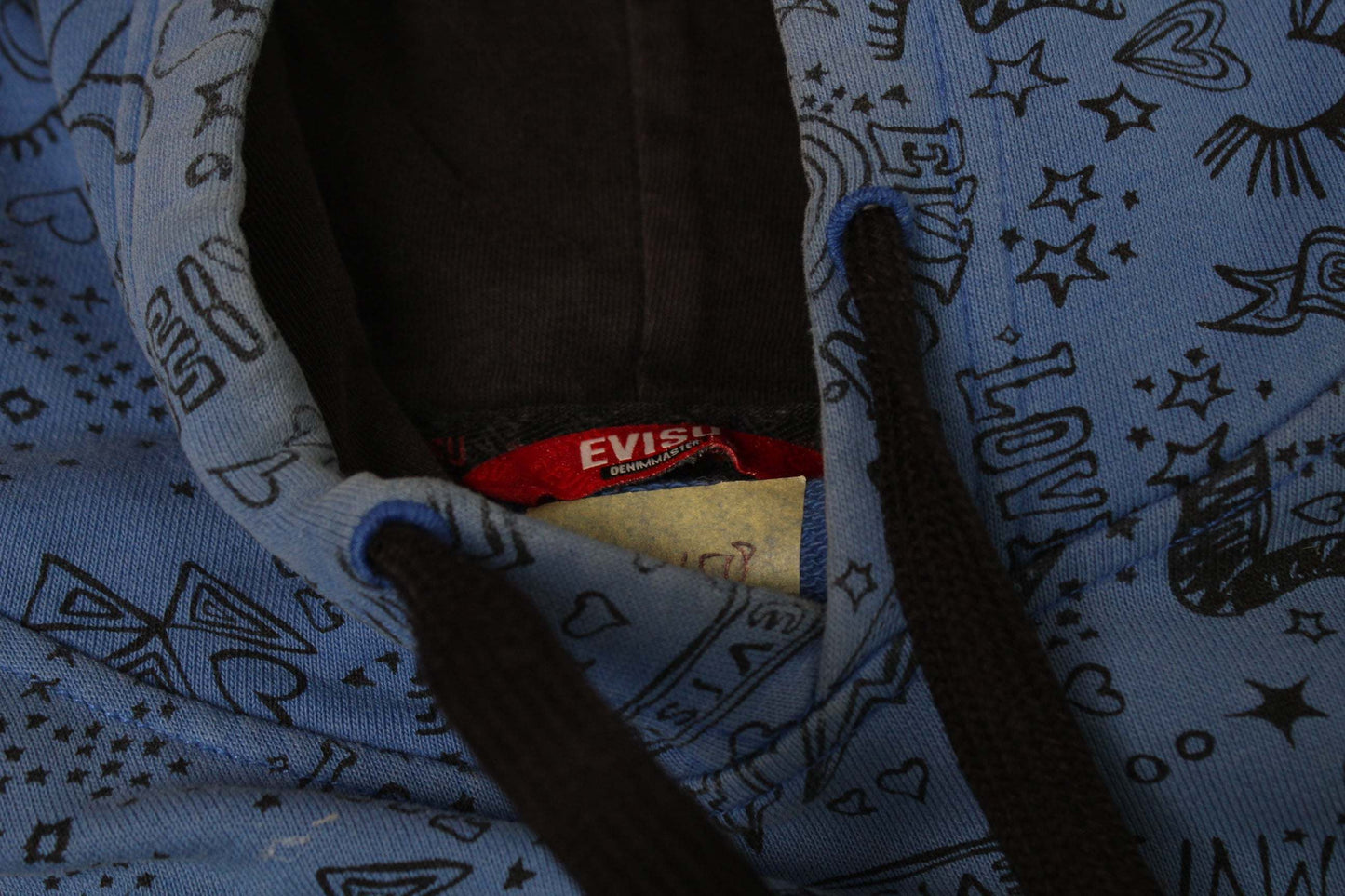 Blue EVISU hoodie with black drawstrings and graphic design.