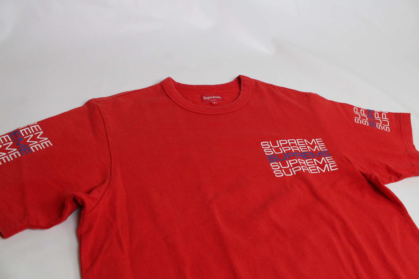 SUPREME red T-shirt with stack logo design, size S, 100% cotton, 8/10 condition.