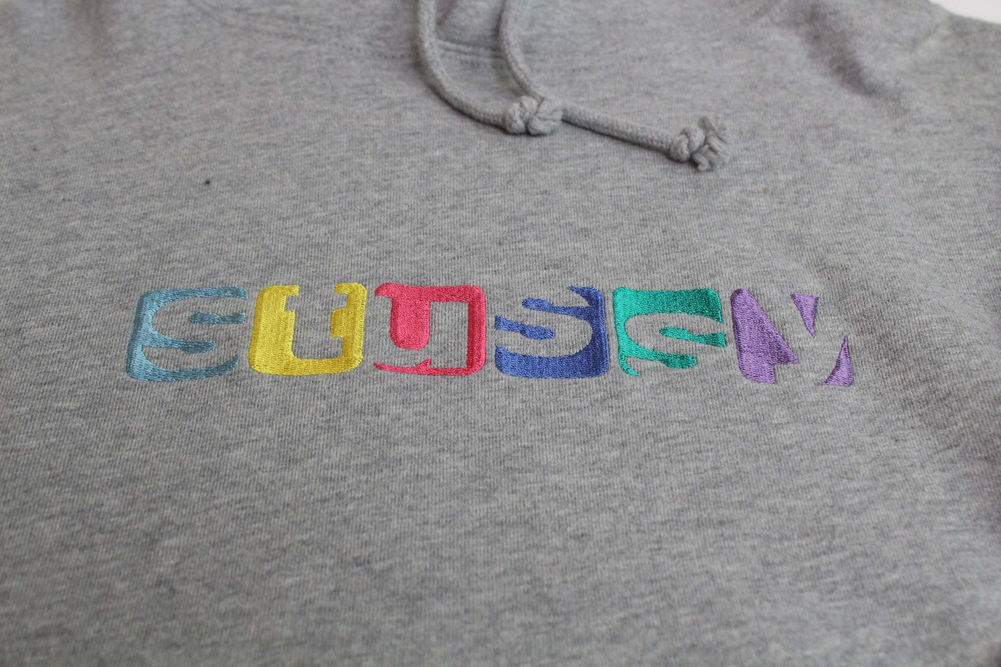 STÜSSY Hoodie Grey Rainbow with colorful logo embroidery on grey cotton fabric.