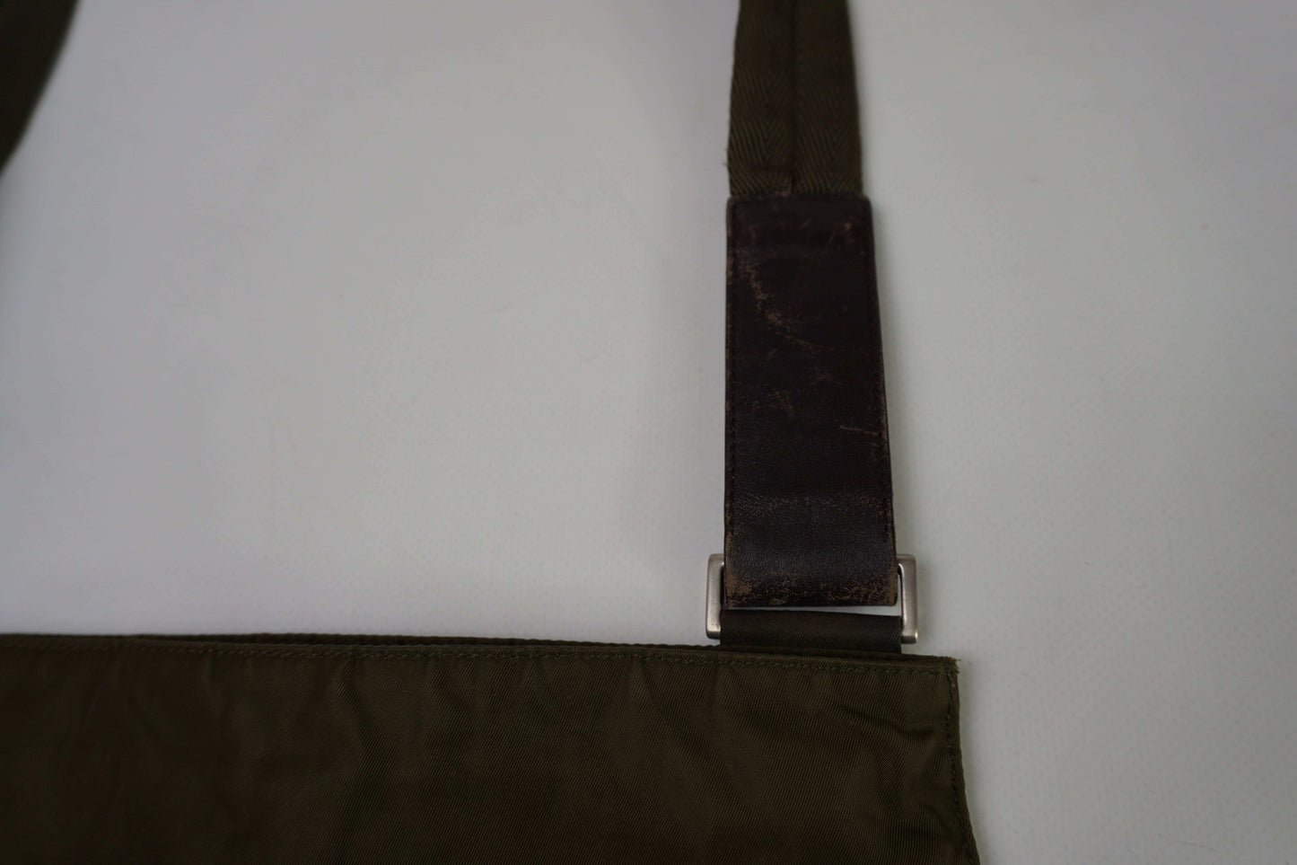 PRADA Slingbag Brown, nylon material, 20x20 cm, condition 8/10, flaws visible.