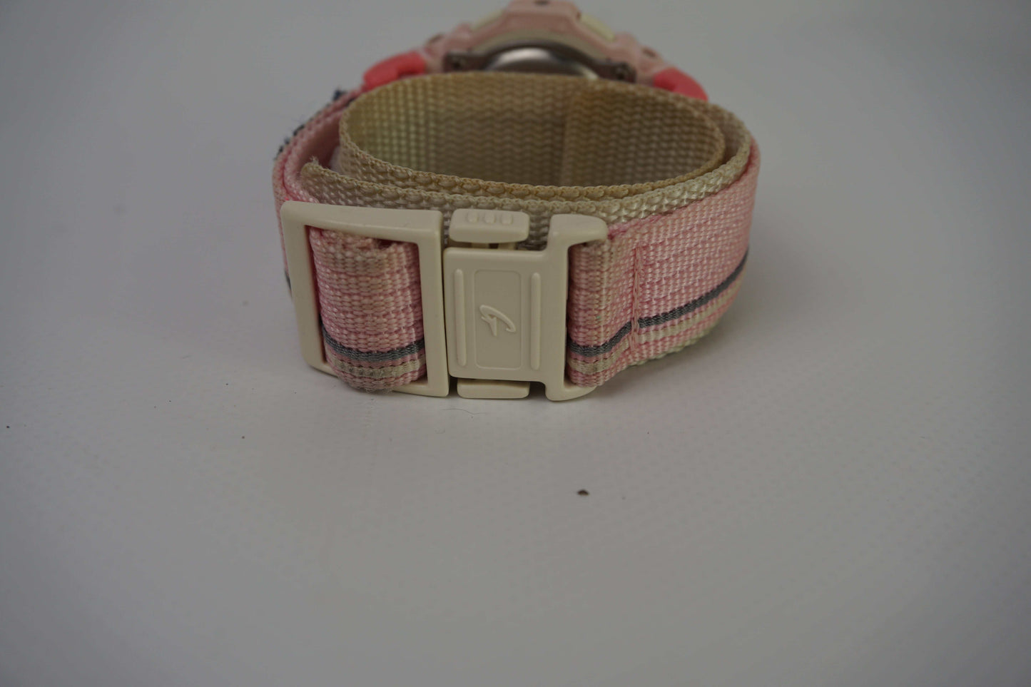 CASIO Baby-G Pink watch with adjustable size, pink and white color, partially visible.