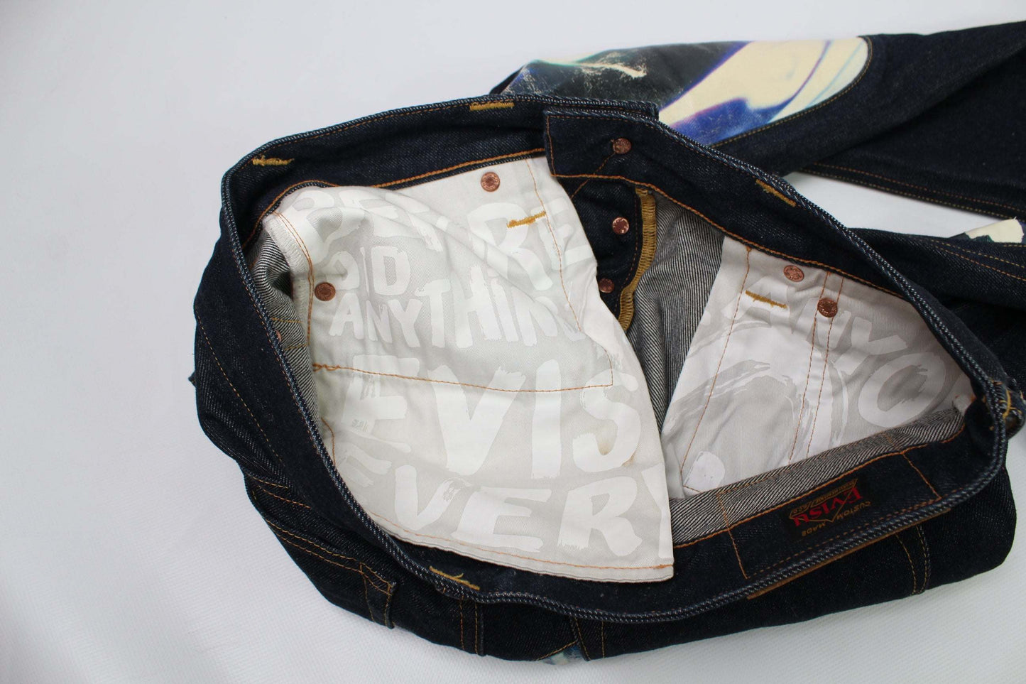 EVISU Blue Daicock Denim Selvedge jeans size 32, baggy fit, dark blue, 100% cotton, selvedge detailing, made in Japan.