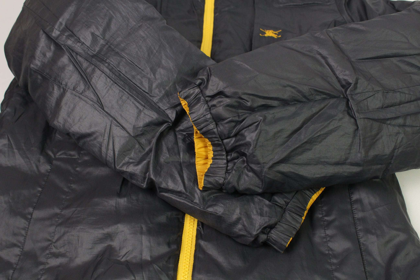 BURBERRY'S Reverse Jacket Yellow in black with yellow lining, polyester material.
