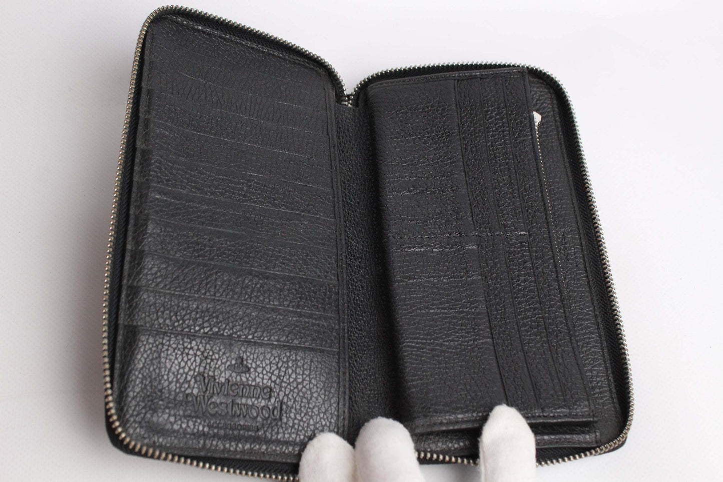 VIVIENNE WESTWOOD Zipper Longwallet Black leather, open view showing interior compartments.