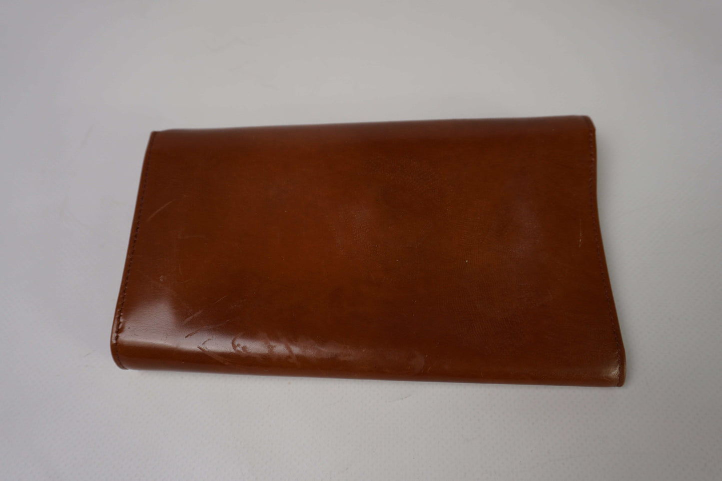 Brown leather Cartier longwallet, size 21x10cm, in 8/10 condition.