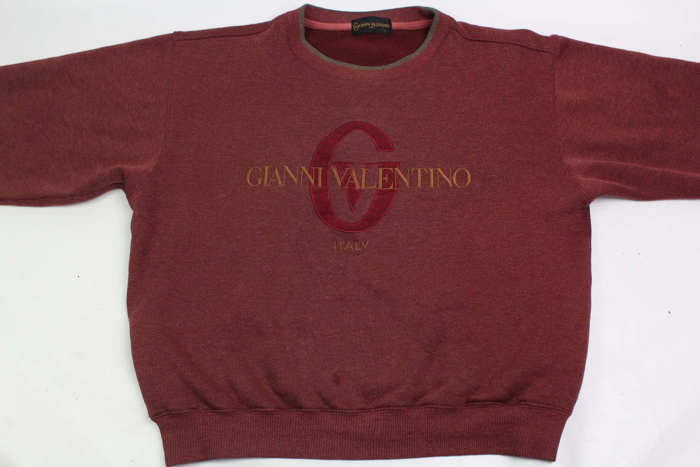 VALENTINO red sweater in size M with visible wear signs.