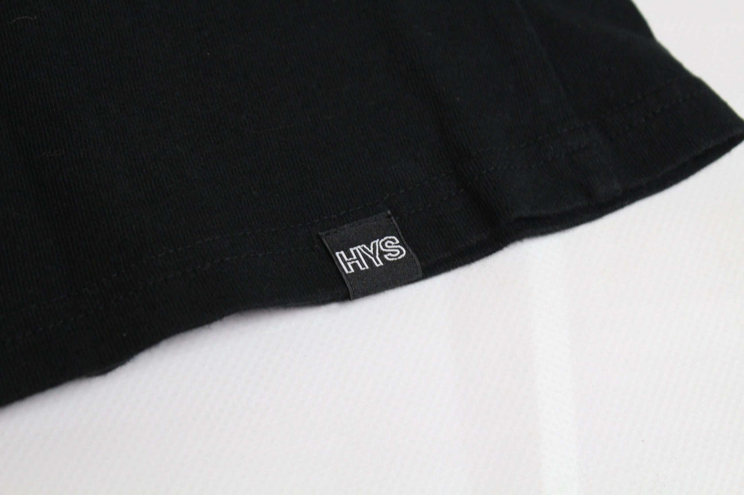 HYSTERIC GLAMOUR black t-shirt close-up with "HYS" label, size M, cotton.