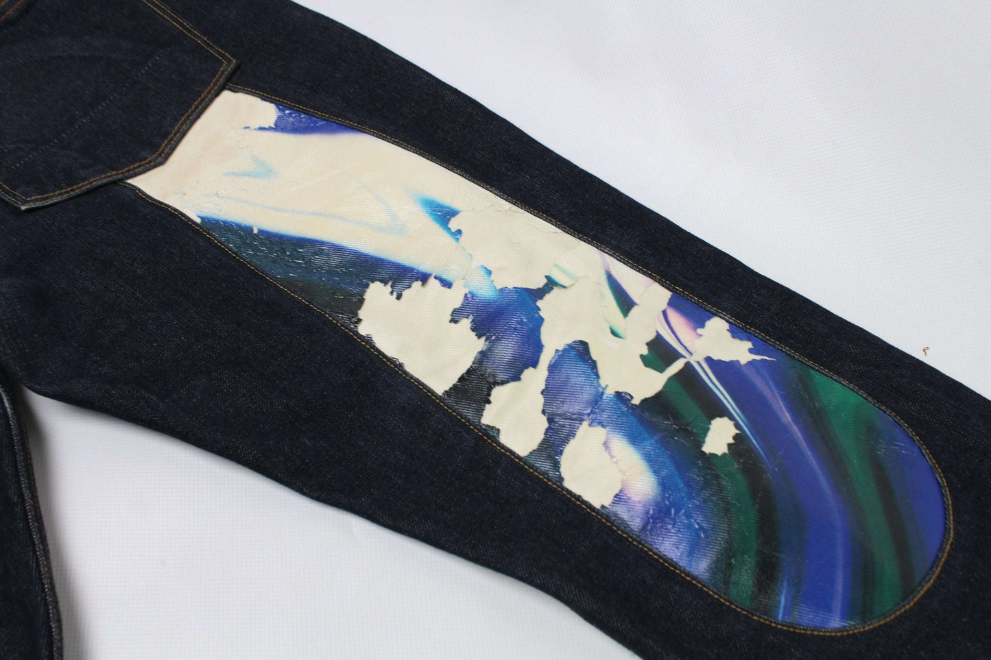 EVISU Blue Daicock Denim Selvedge with colorful pattern and selvedge detail.