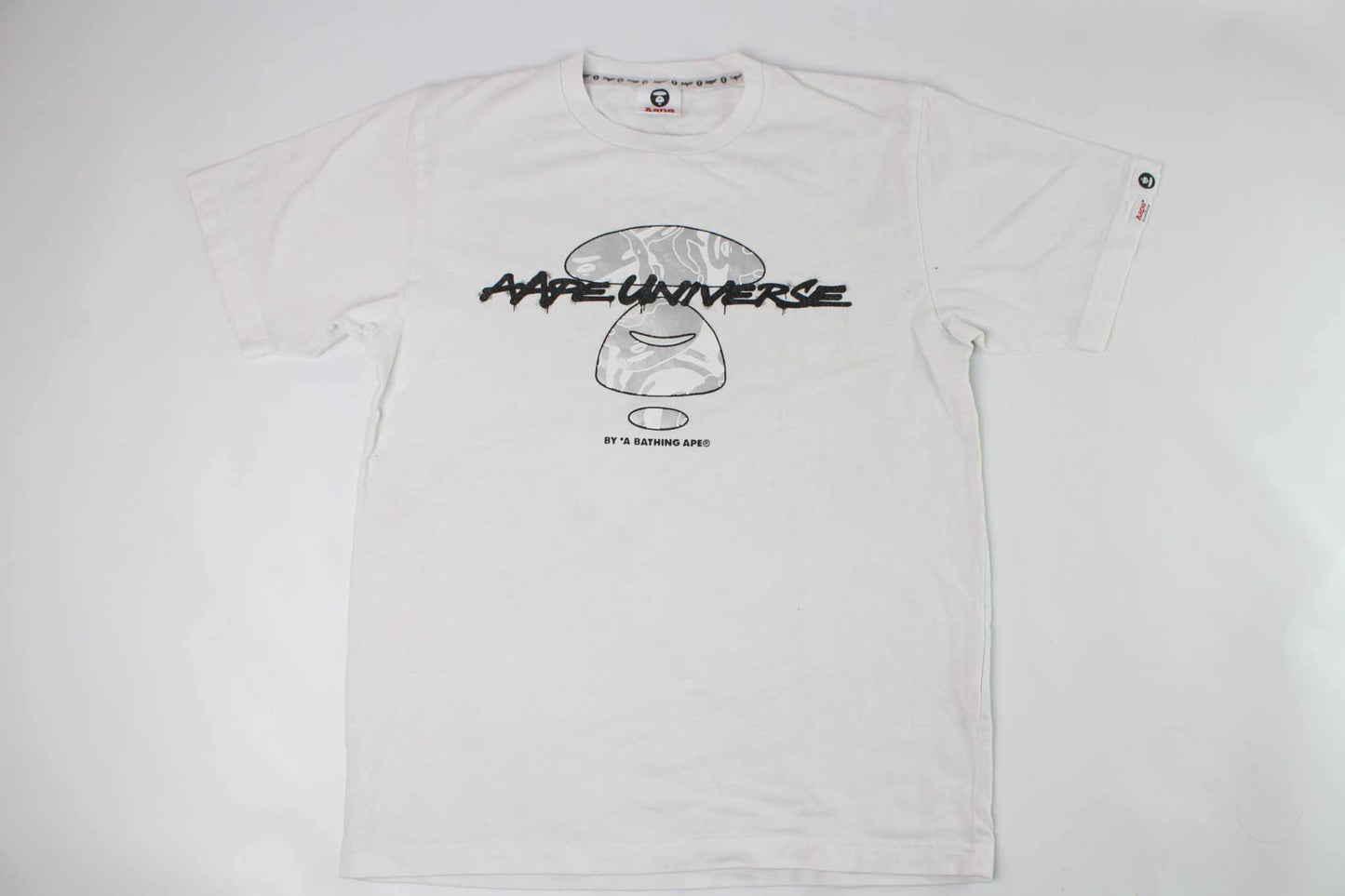 BAPE AAPE Laser Foil Camo Stencil Face TeeBAPE AAPE Laser Foil Camo Stencil Face Tee | LAYZSSHOP | Bape