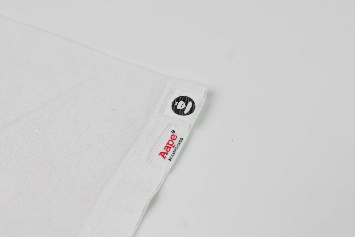BAPE AAPE Laser Foil Camo Stencil Face TeeBAPE AAPE Laser Foil Camo Stencil Face Tee | LAYZSSHOP | Bape