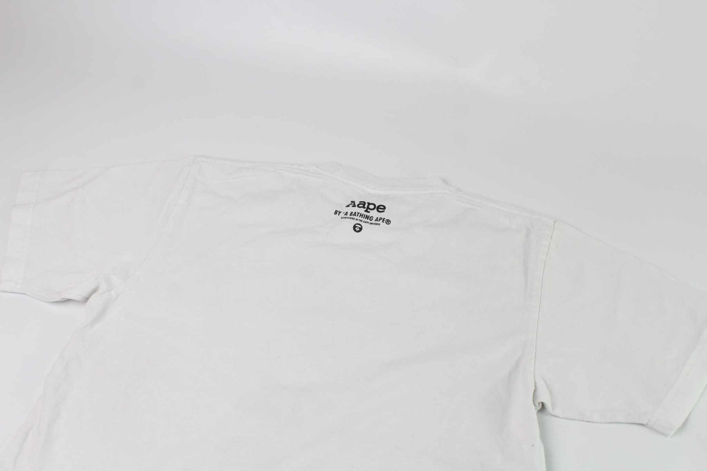BAPE AAPE Laser Foil Camo Stencil Face TeeBAPE AAPE Laser Foil Camo Stencil Face Tee | LAYZSSHOP | Bape