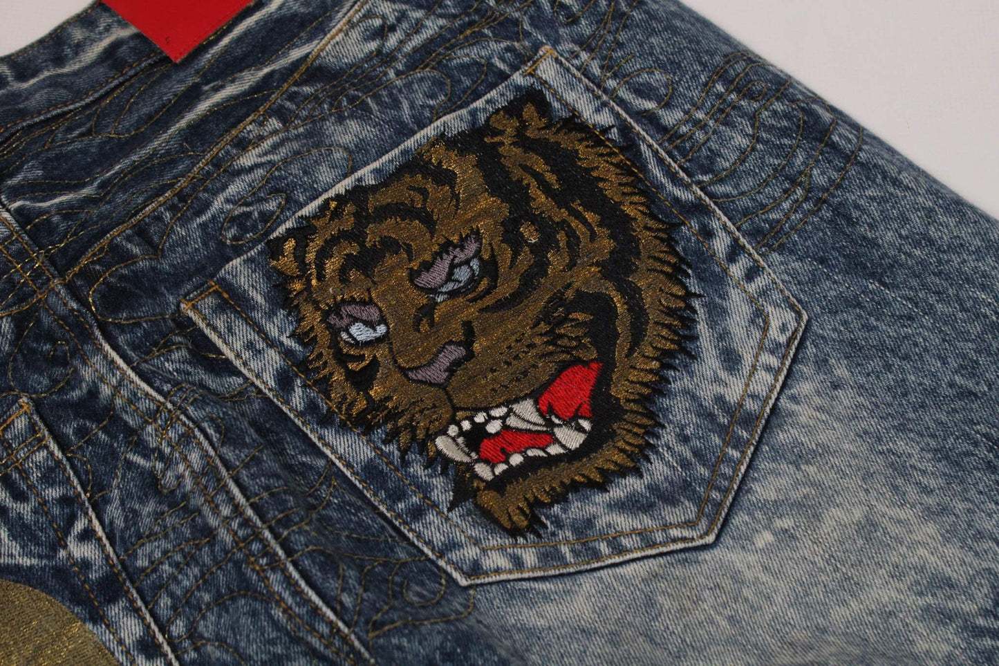BIG TRAIN Embroidery Tiger Denim with tiger design on back pocket, blue baggy jeans.