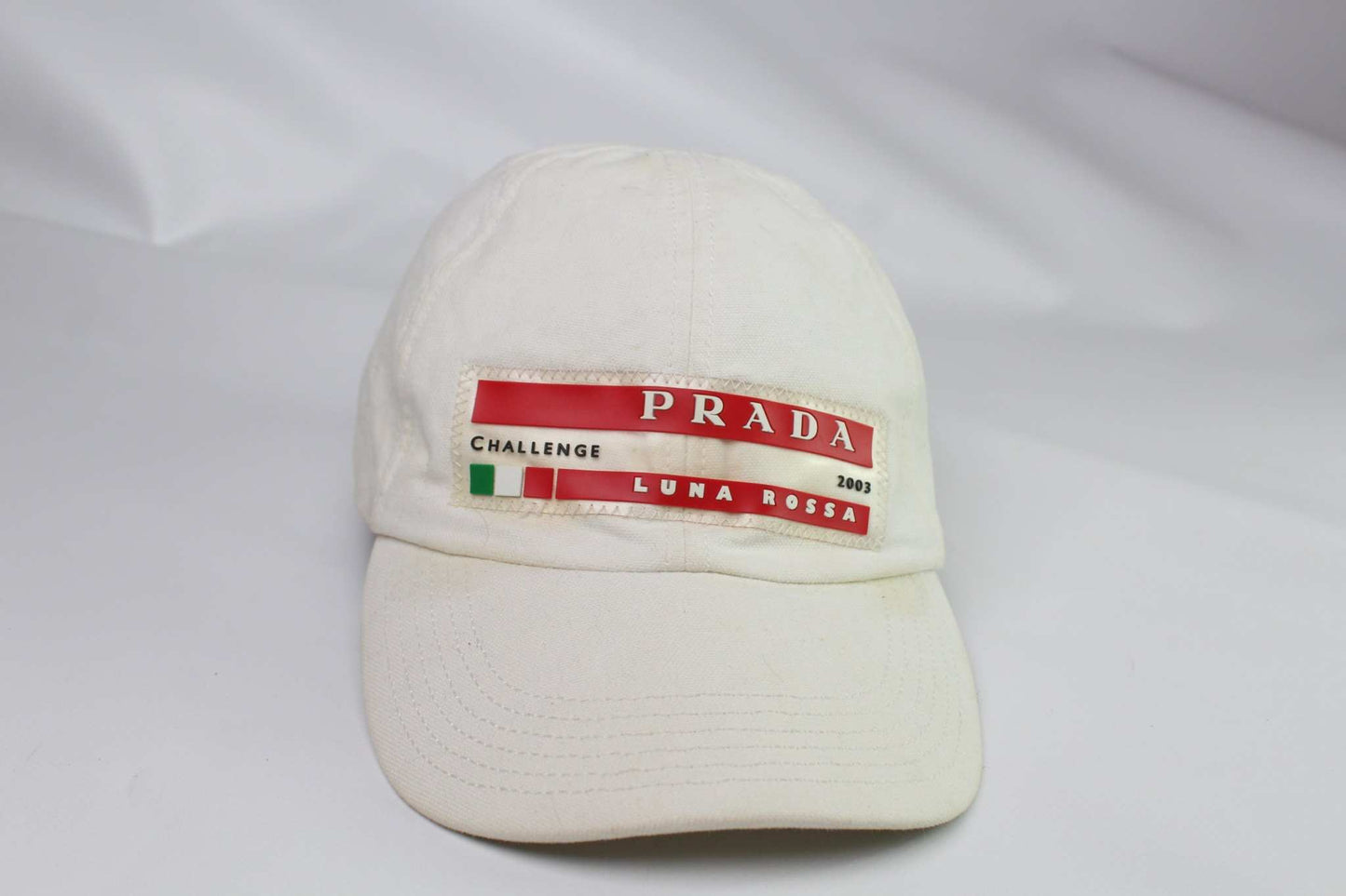 PRADA Luna Rossa Cap White with logo and red accents.
