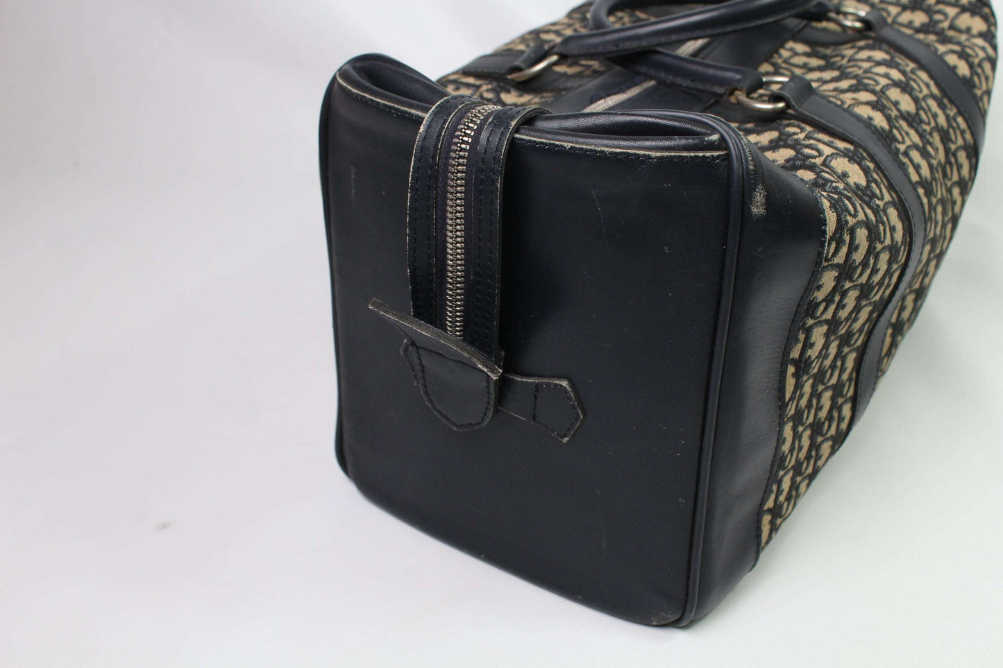 DIOR Keepall Monogram bag in black canvas and leather with slight zip tear.