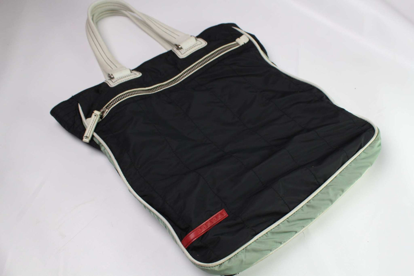 PRADA Sports Shopper in dark blue nylon with white handles.
