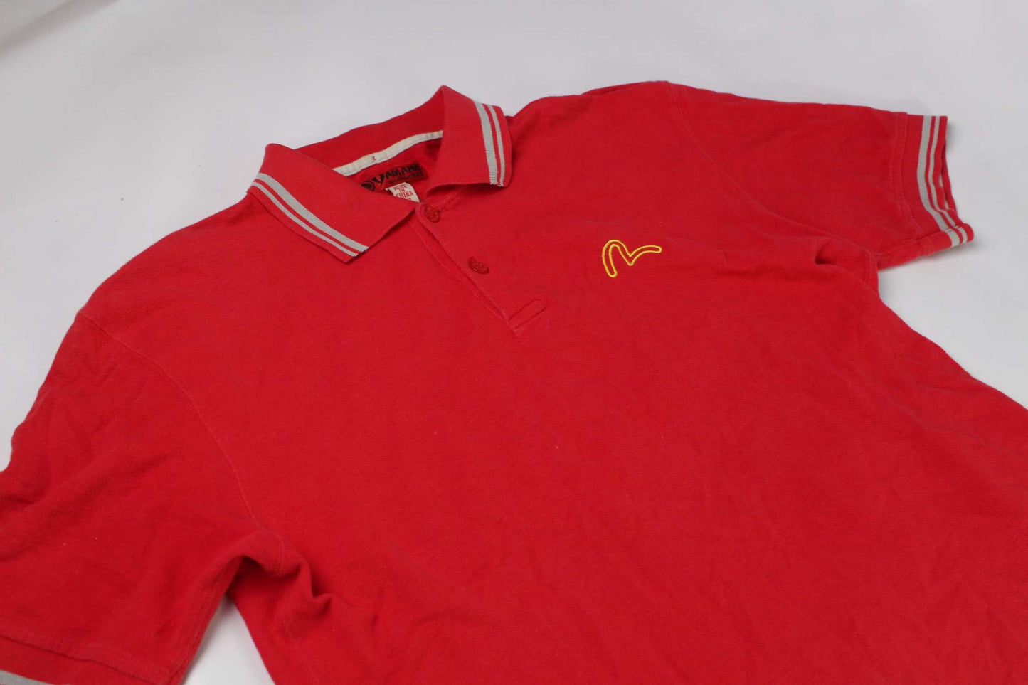 Red EVISU polo shirt, size M, 100% cotton, condition 8/10, with logo detailing.