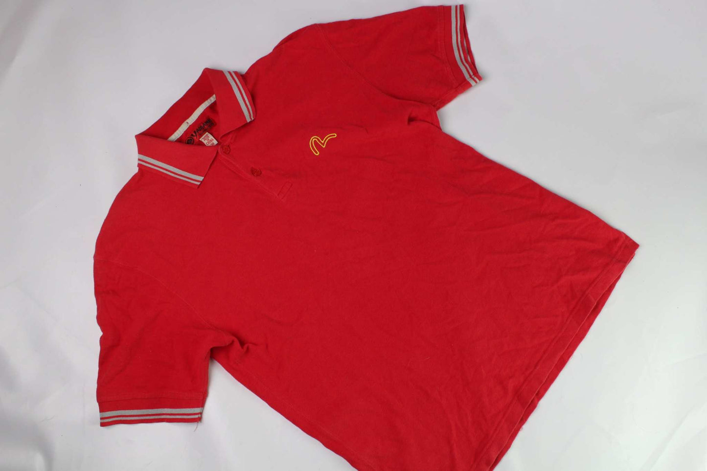 Red EVISU polo shirt, size M, cotton material, with striped collar and logo embroidery.