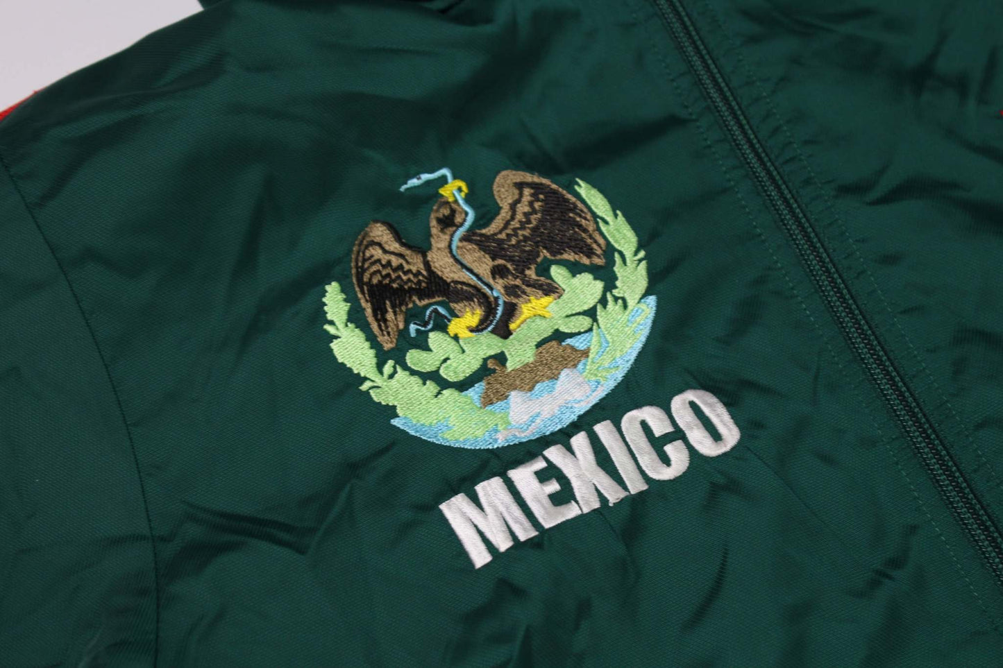 Green Adidas Mexico track jacket with Mexican emblem embroidery.