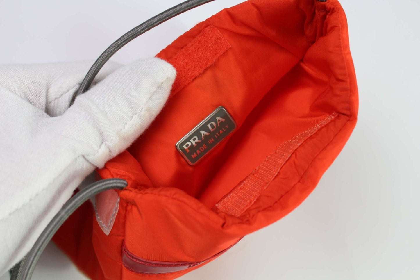 PRADA Sports Slingbag Orange, nylon with elastic straps, size 20x17 cm.