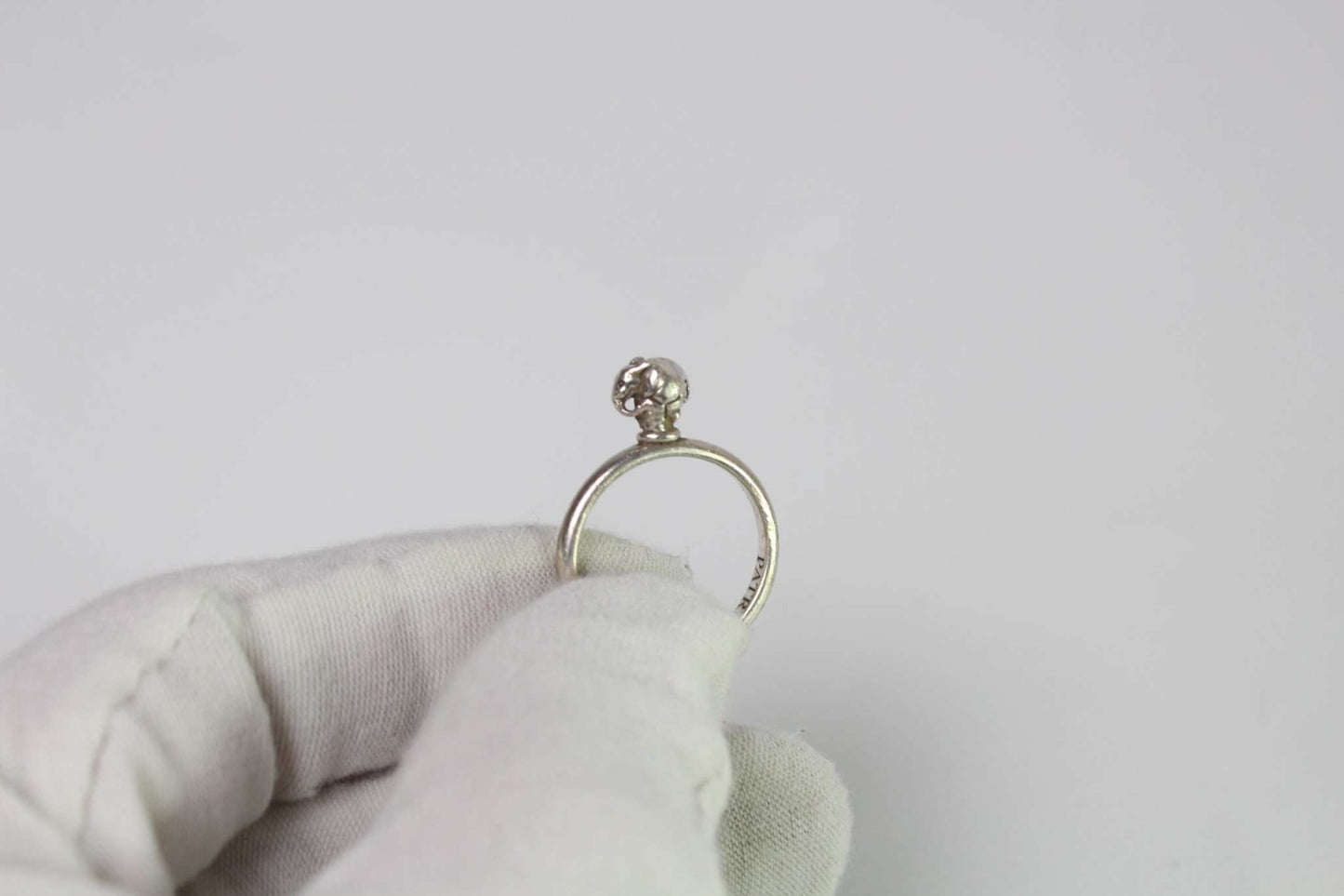 PATRICK MAVROS 925S silver ring in 8/10 condition held in gloved hand.