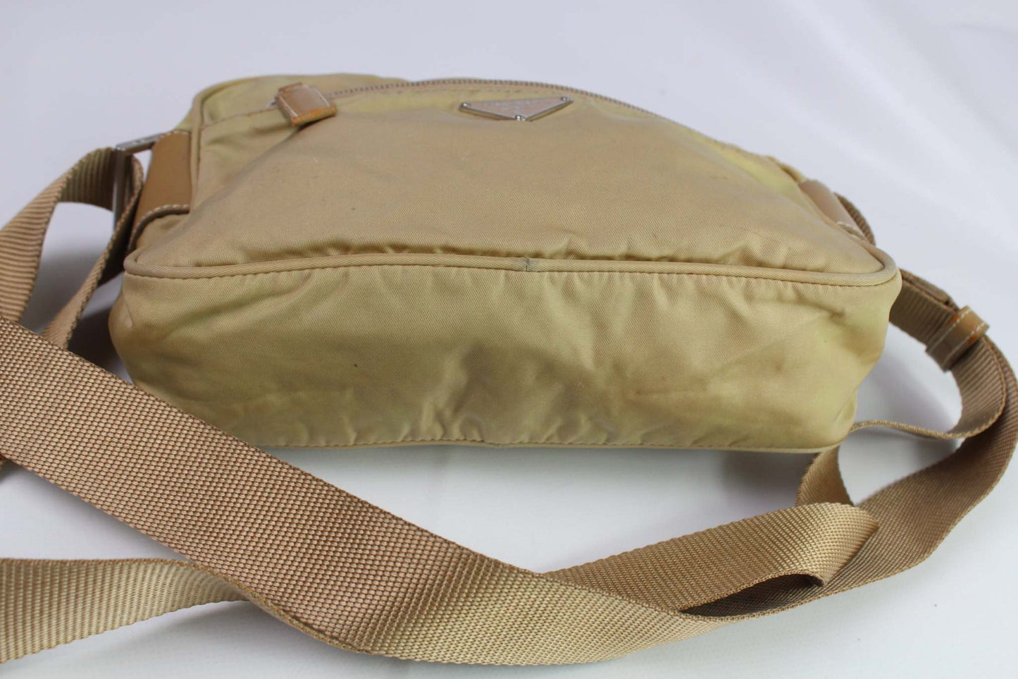 PRADA beige nylon crossbody bag with adjustable strap.