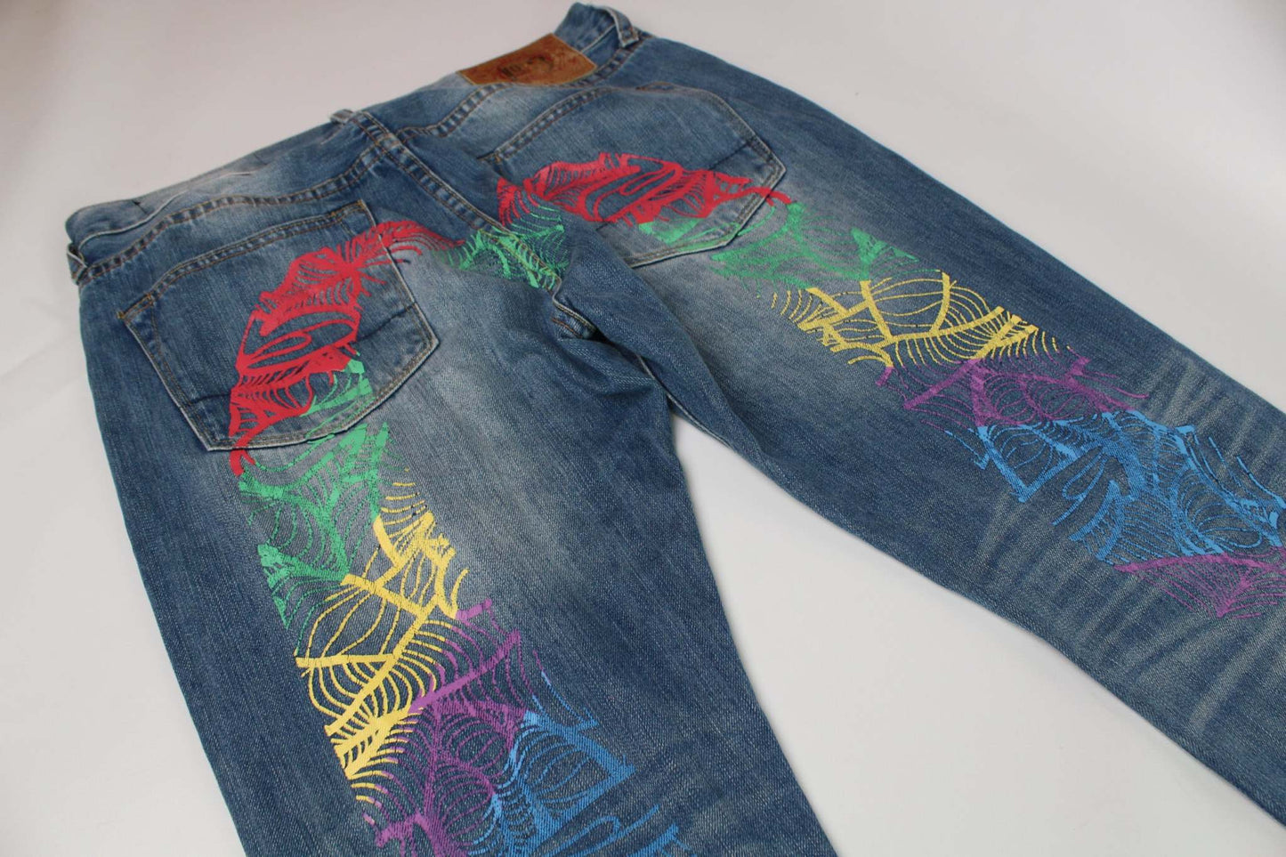 EVISU Rainbow Daicock Denim Pants, dark blue with orange and blue accents, baggy fit, size 34x33, cotton material.