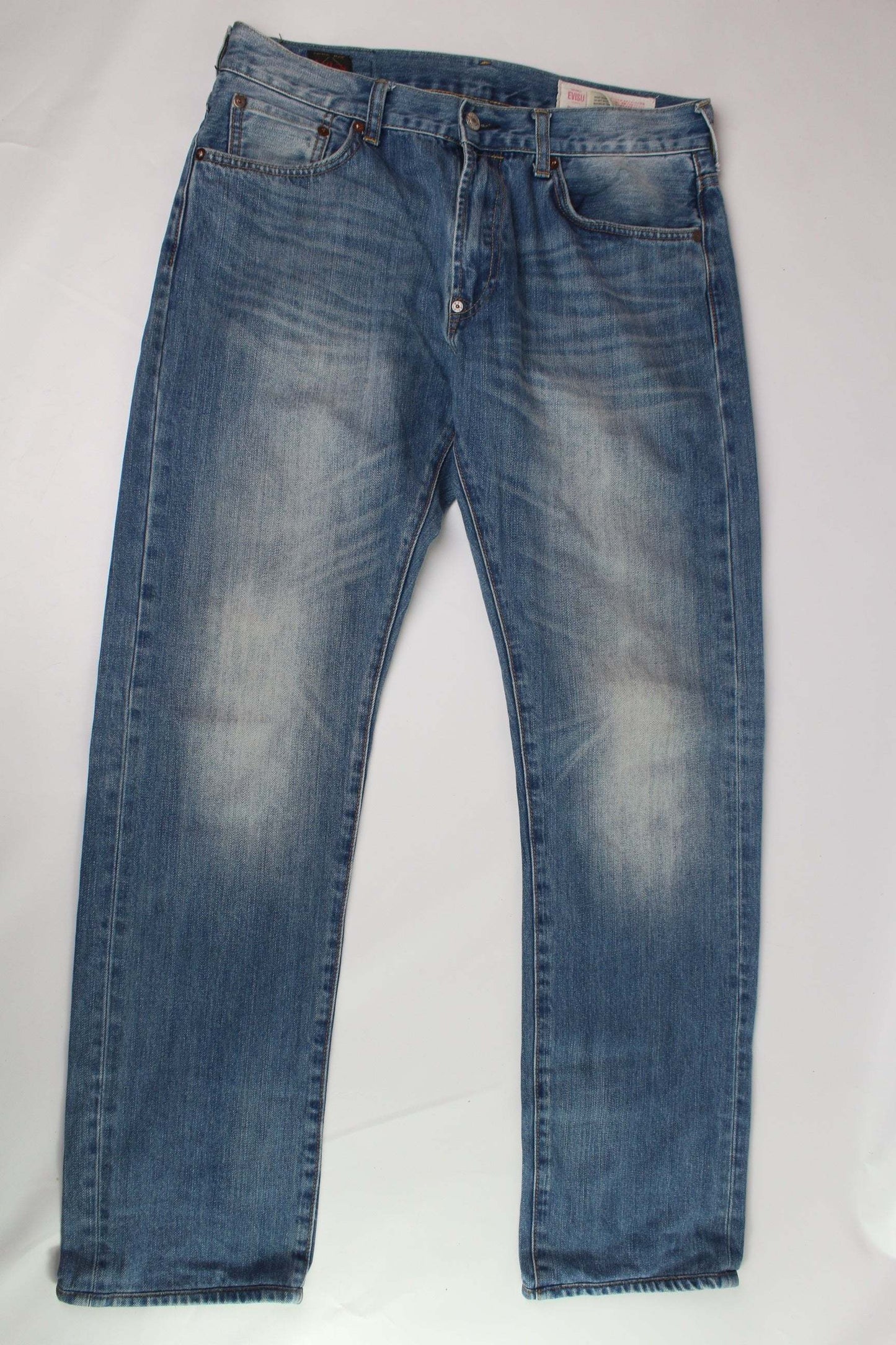 EVISU Rainbow Daicock Denim Pants in dark blue with orange and blue details, baggy fit, 100% cotton.