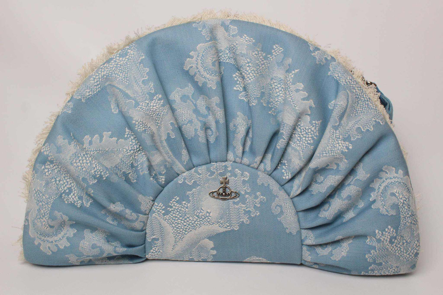 VIVIENNE WESTWOOD Victoria Frame Clutch in baby blue with intricate design.