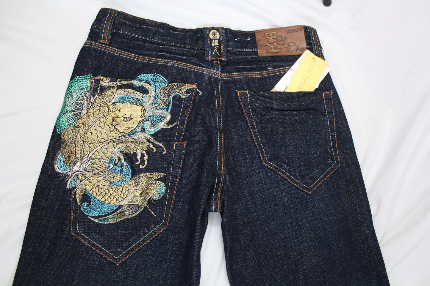 BIG TRAIN Koi Embroidery Denim jeans, size M, straight/skinny fit, back view with koi design.