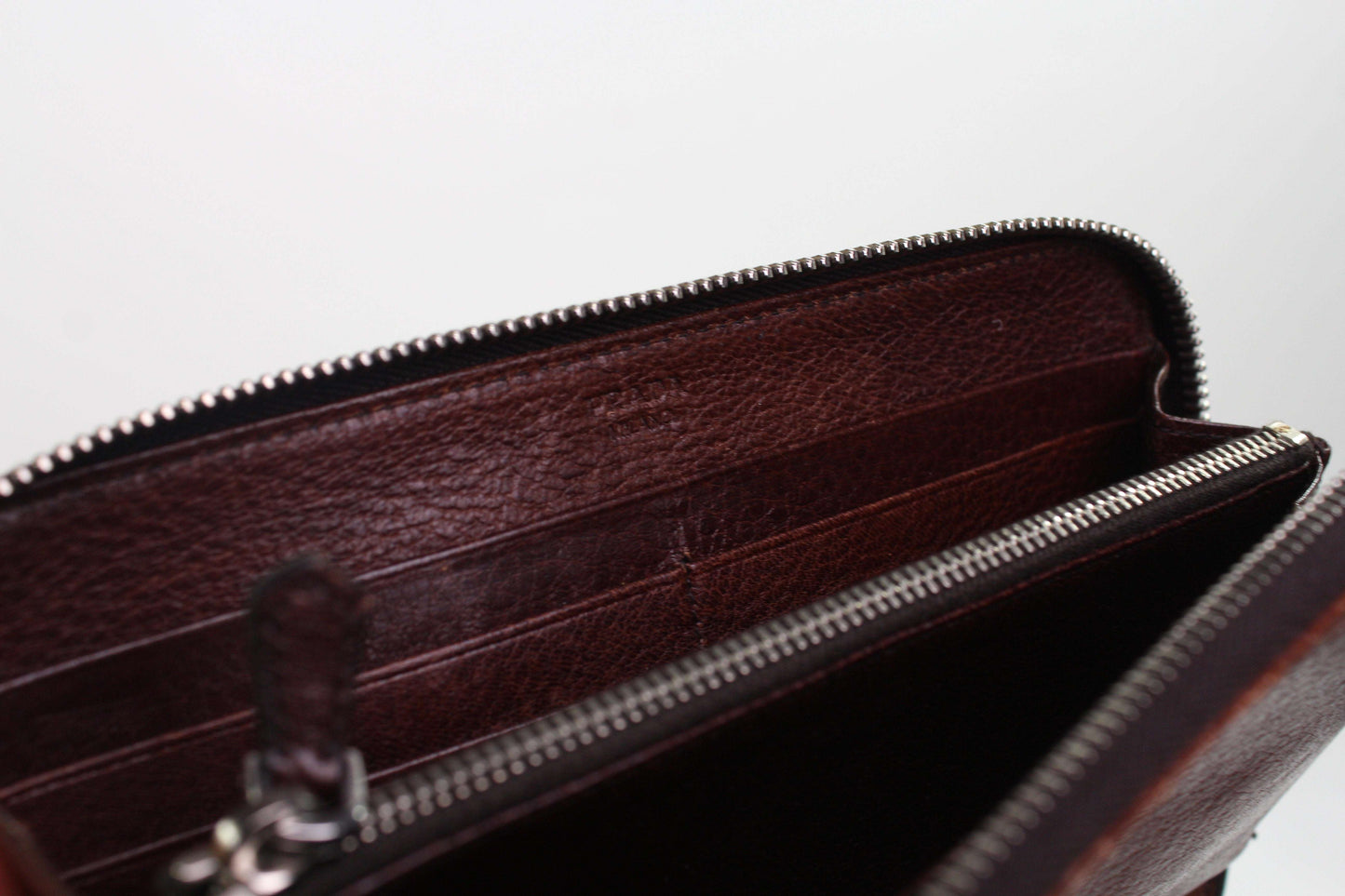 PRADA Leather Longwallet Brown interior view showing zip and compartments