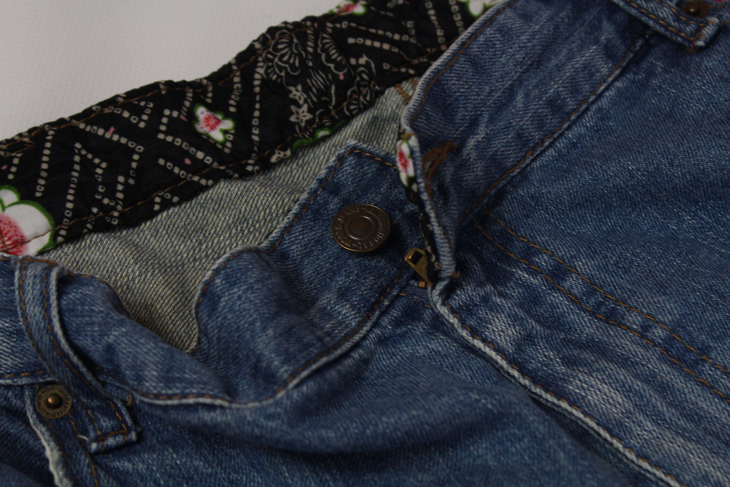 Japanese Koi Denim blue jeans with floral waistband detail, size 34, cotton material.