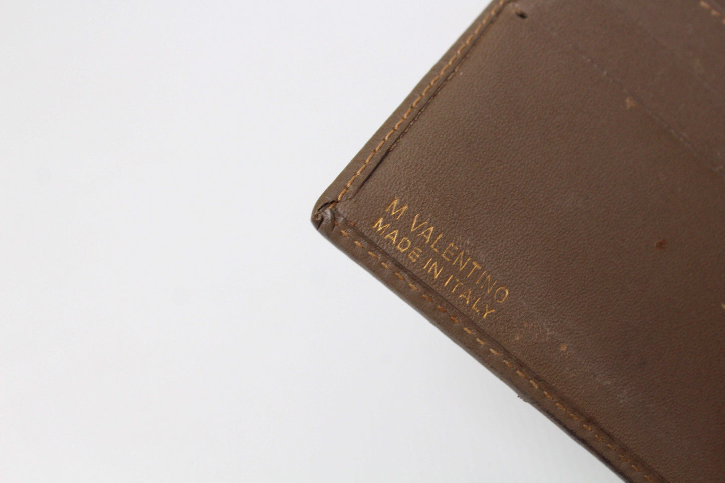 Brown Valentino wallet with monogram design, size 10x10, exterior rated 6/10, interior 8/10, visible flaws, made in Italy.
