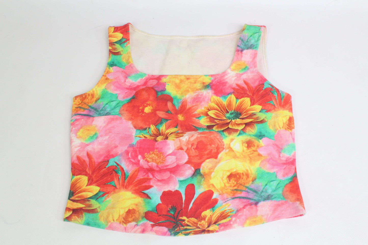Colorful DIOR Flower Top, size S, with floral pattern and light wear.
