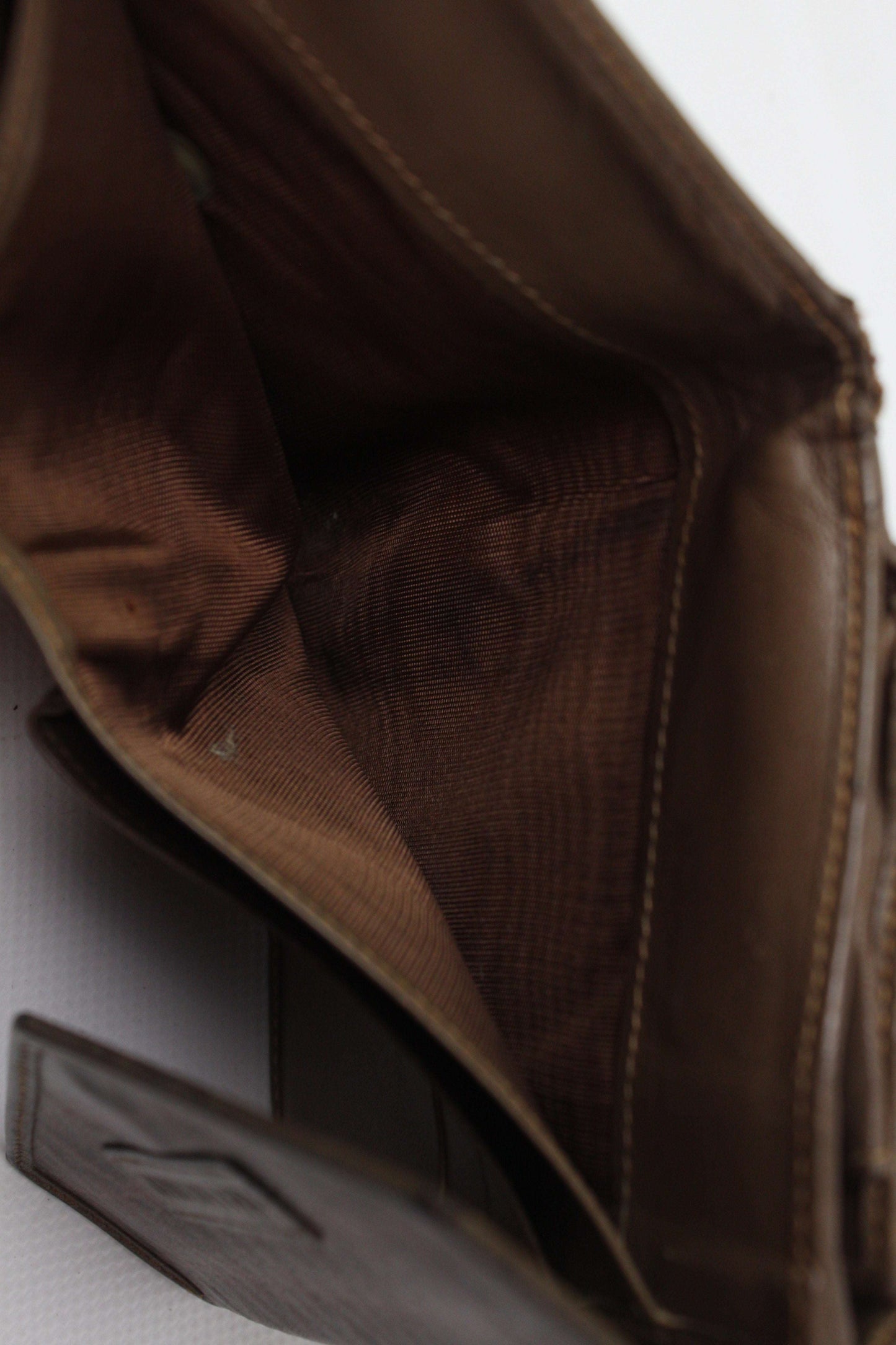 Brown VALENTINO wallet with monogram design, showing interior condition.