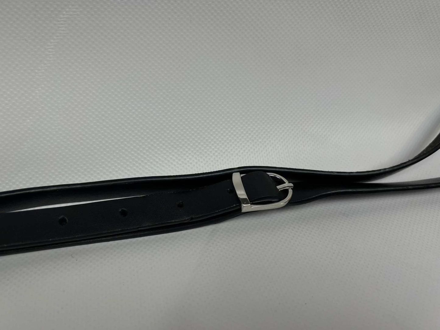 PRADA Slingbag Black with silver buckle strap, nylon material.