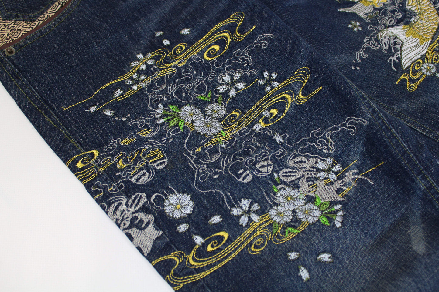 Seku Embroidery Denim, slim/straight fit, blue cotton fabric with intricate floral embroidery design.