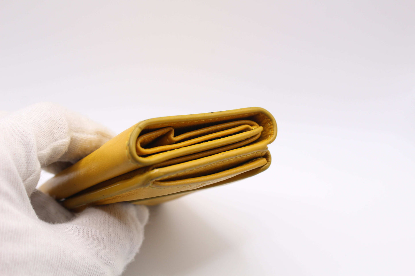 Yellow Balenciaga Portmonee wallet made of leather, size 10x7, with slight wear marks.