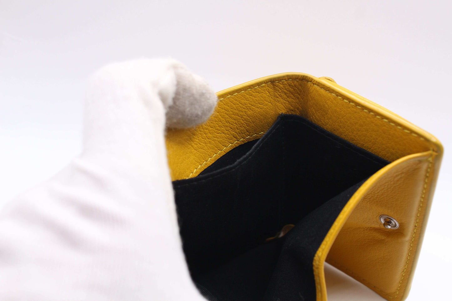 Balenciaga Portmonee Yellow leather wallet open interior view.