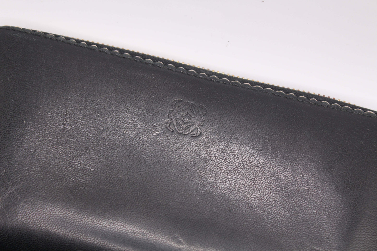 Black Loewe long leather wallet with logo.