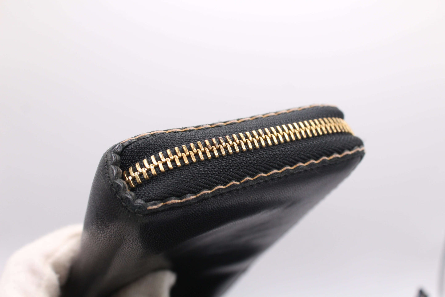 Black leather Loewe long wallet with gold zipper, size 20x10 cm.