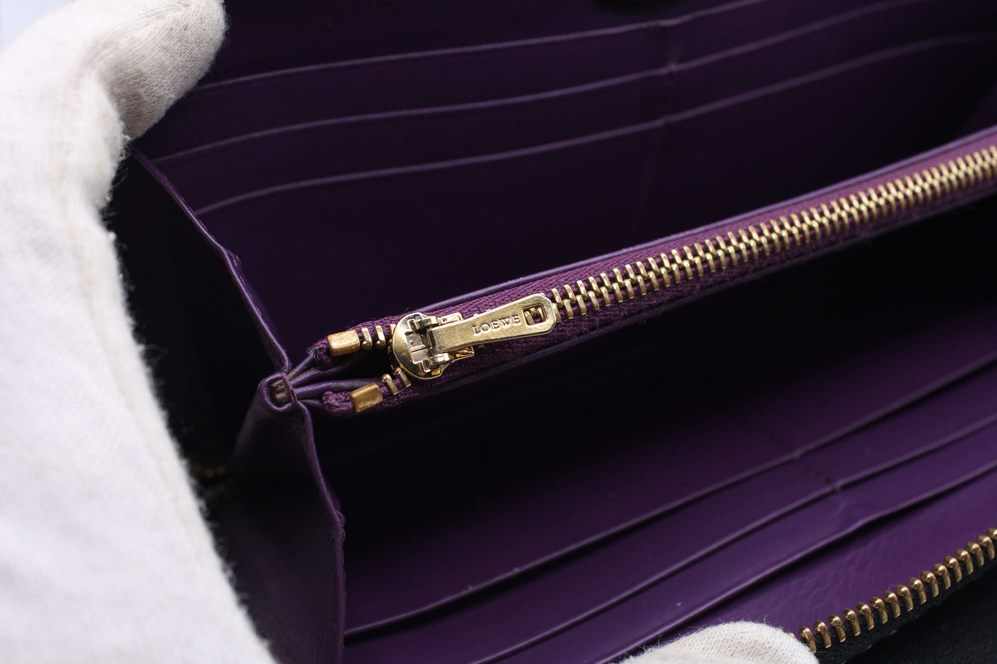 Inside view of Loewe Long Wallet with purple interior and gold zipper.