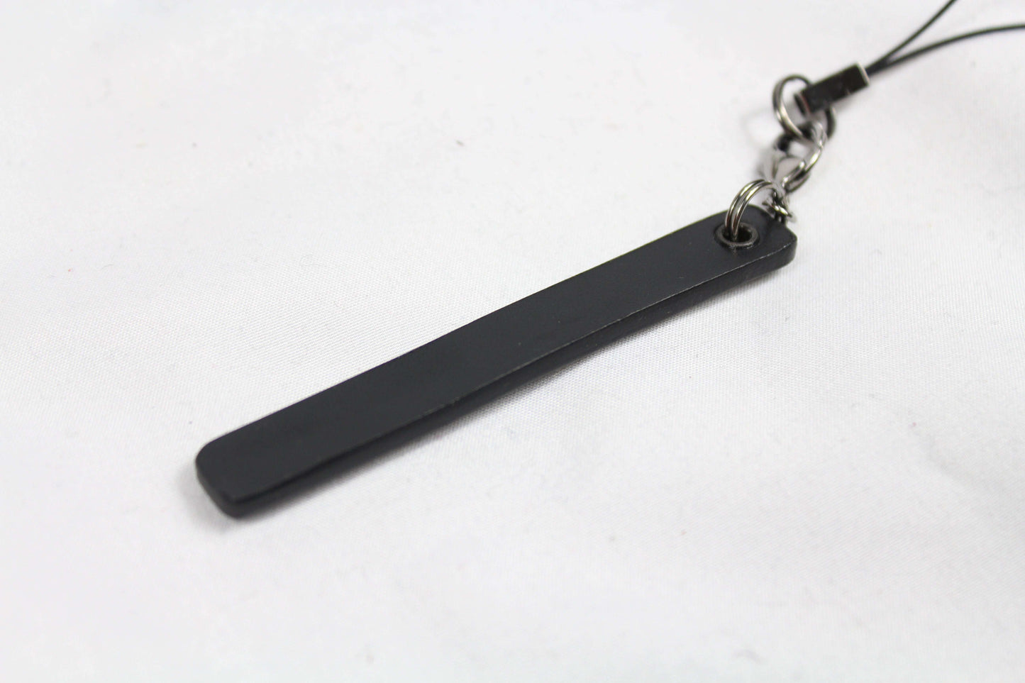 Black Gucci keychain in good condition.