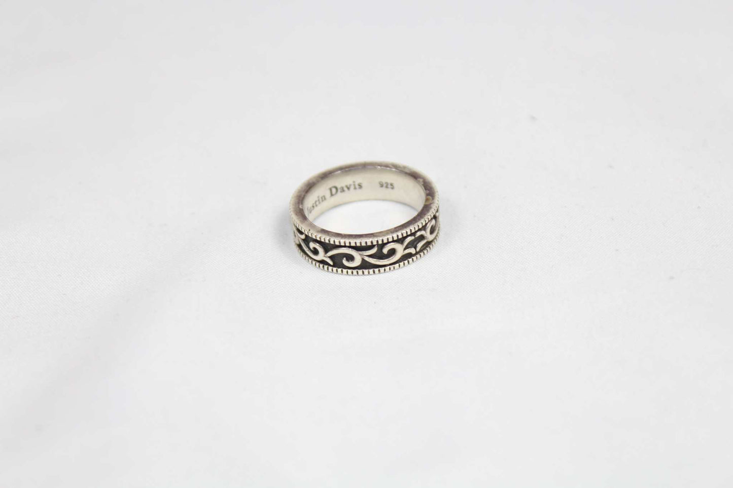 Justin Davis 925 SV Ring, silver with intricate design, size 19mm, slightly scratched.
