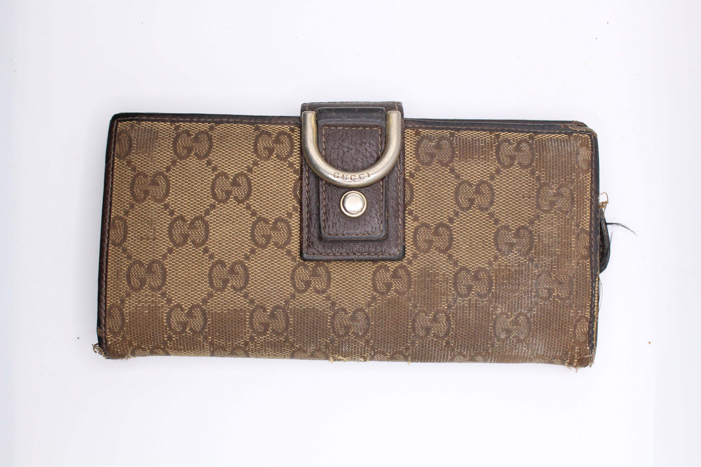 GUCCI Longwallet Monogram in brown and cream canvas with leather trim.